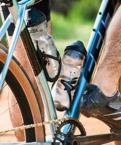 Dawn To Dusk Sideburn 6 Water Bottle Cage For Gravel And Mountain Bikes (Left) | Bottle Cages 8 Dawn To Dusk Sideburn 6 Water Bottle Cage For Gravel And Mountain Bikes (Left) | Bottle Cages -New Triathlete Store H9qoIIMxMULaLybw2F4f8qnK0